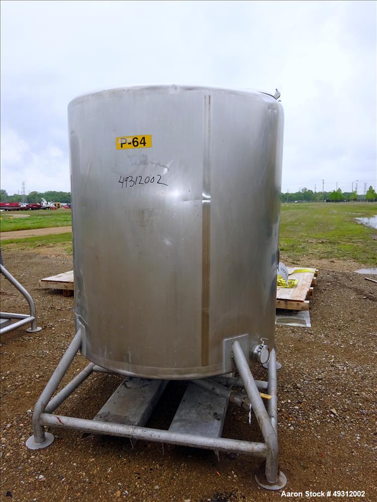 Used Tank, 500 Gallon, Stainless Steel, Vertical. Approximate 52" diameter x 54" straight side, flet top, coned bottom. Openings top 20" manway with cover, 4", side bottom 3", approximate 2" tangenti...