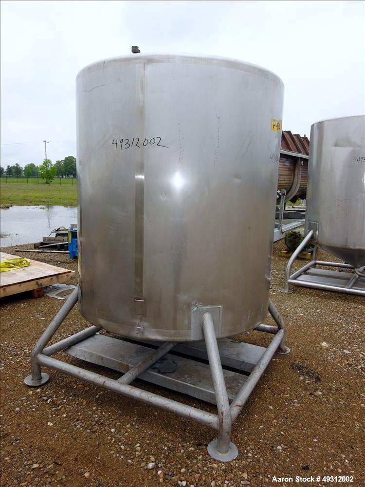 Used Tank, 500 Gallon, Stainless Steel, Vertical. Approximate 52" diameter x 54" straight side, flet top, coned bottom. Openings top 20" manway with cover, 4", side bottom 3", approximate 2" tangenti...