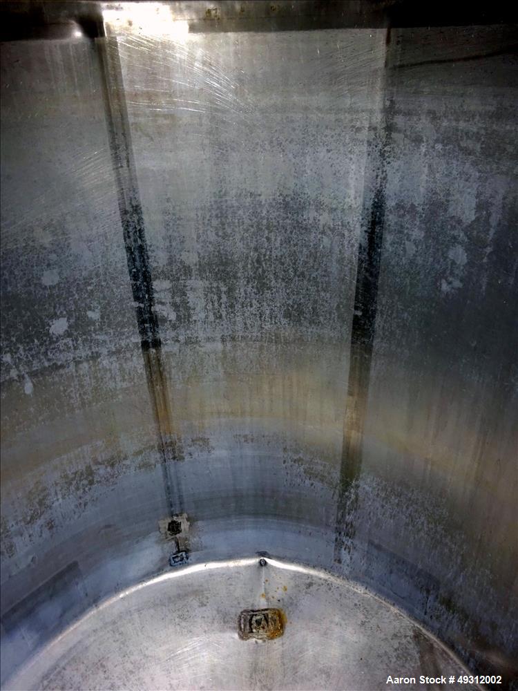 Used Tank, 500 Gallon, Stainless Steel, Vertical. Approximate 52" diameter x 54" straight side, flet top, coned bottom. Openings top 20" manway with cover, 4", side bottom 3", approximate 2" tangenti...