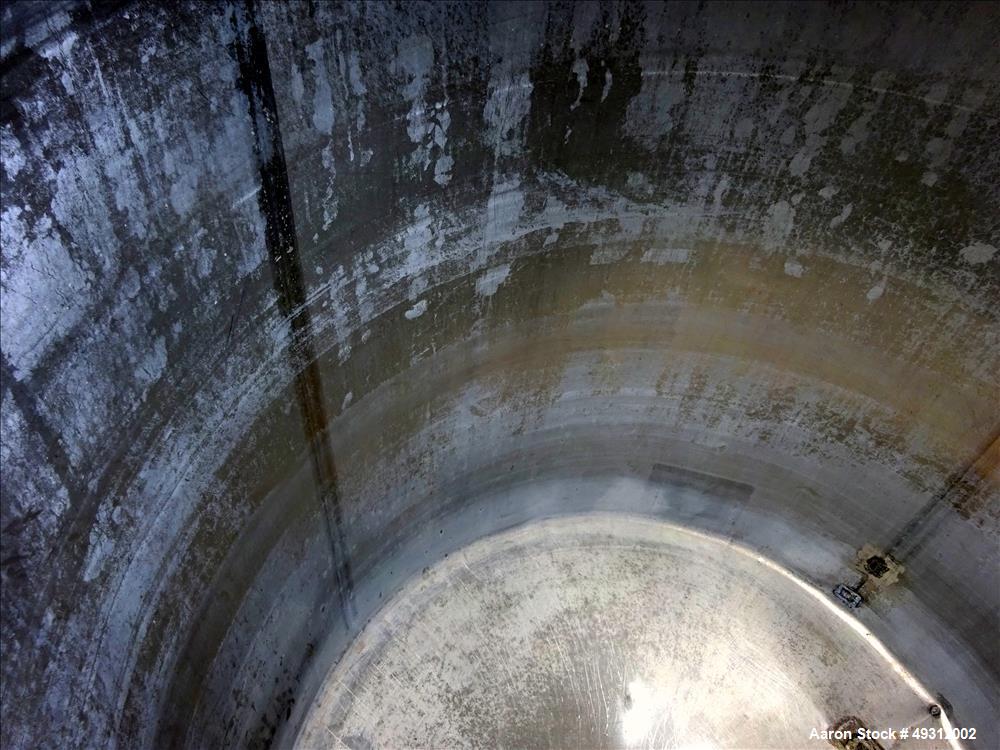 Used Tank, 500 Gallon, Stainless Steel, Vertical. Approximate 52" diameter x 54" straight side, flet top, coned bottom. Openings top 20" manway with cover, 4", side bottom 3", approximate 2" tangenti...