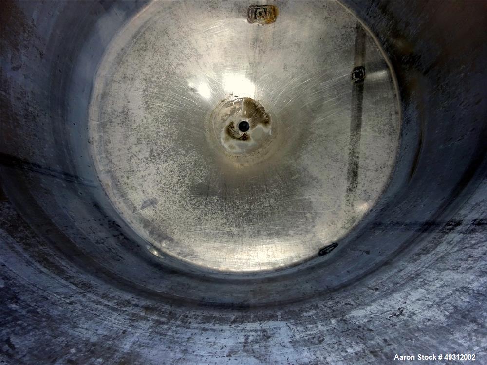Used Tank, 500 Gallon, Stainless Steel, Vertical. Approximate 52" diameter x 54" straight side, flet top, coned bottom. Openings top 20" manway with cover, 4", side bottom 3", approximate 2" tangenti...