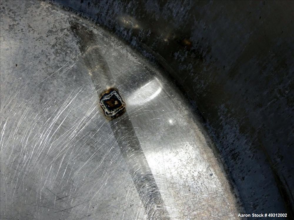 Used Tank, 500 Gallon, Stainless Steel, Vertical. Approximate 52" diameter x 54" straight side, flet top, coned bottom. Openings top 20" manway with cover, 4", side bottom 3", approximate 2" tangenti...