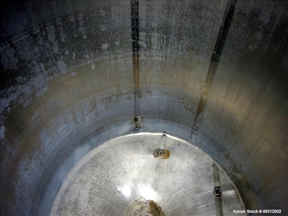 Used Tank, 500 Gallon, Stainless Steel, Vertical. Approximate 52" diameter x 54" straight side, flet top, coned bottom. Openings top 20" manway with cover, 4", side bottom 3", approximate 2" tangenti...