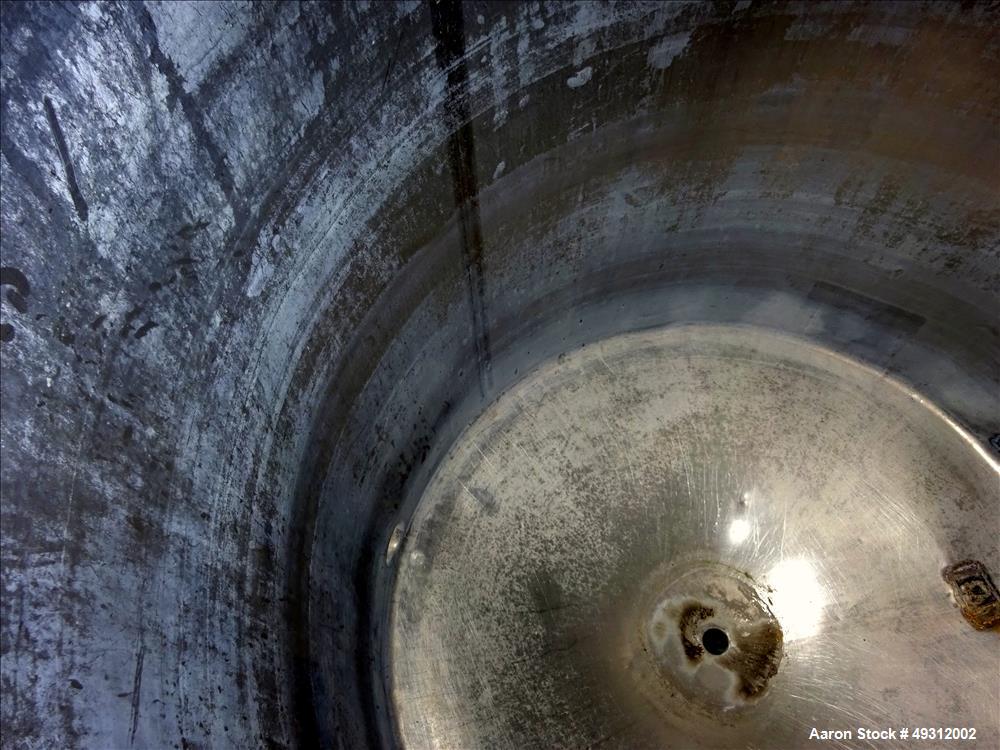 Used Tank, 500 Gallon, Stainless Steel, Vertical. Approximate 52" diameter x 54" straight side, flet top, coned bottom. Openings top 20" manway with cover, 4", side bottom 3", approximate 2" tangenti...