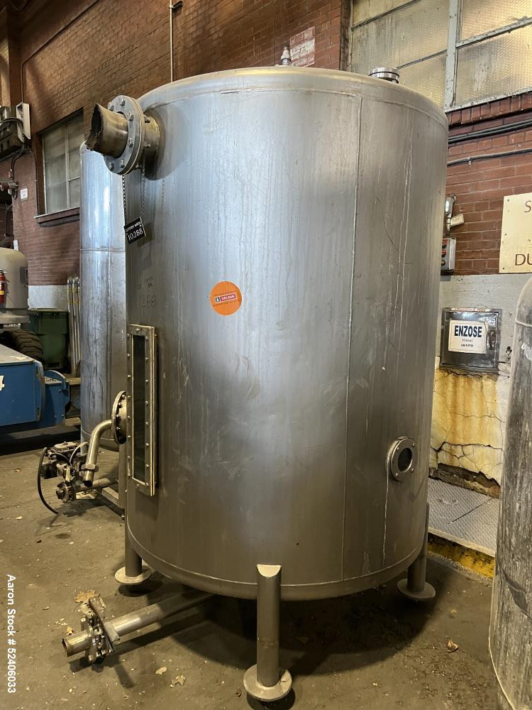 Used Tank, Approximate 950 Gallon, Stainless Steel, Vertical. Approximate 60" diameter x 72" straight side, dished top & bottom. Mounted on 4 stainless legs.