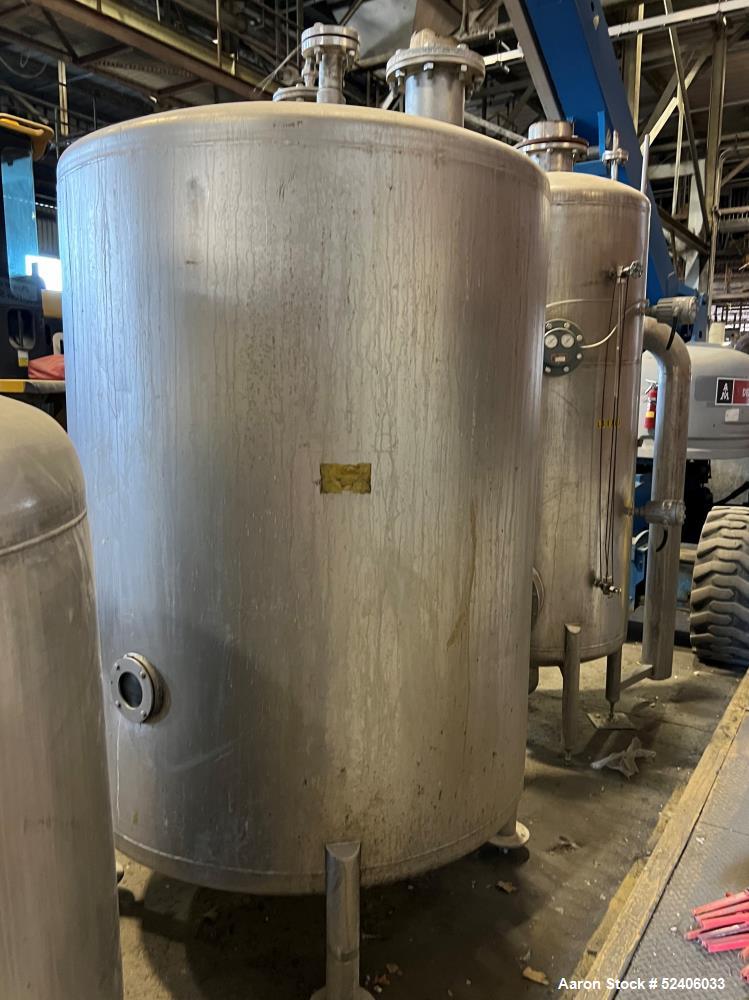Used Tank, Approximate 950 Gallon, Stainless Steel, Vertical. Approximate 60" diameter x 72" straight side, dished top & bottom. Mounted on 4 stainless legs.