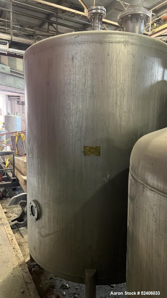 Used Tank, Approximate 950 Gallon, Stainless Steel, Vertical. Approximate 60" diameter x 72" straight side, dished top & bottom. Mounted on 4 stainless legs.