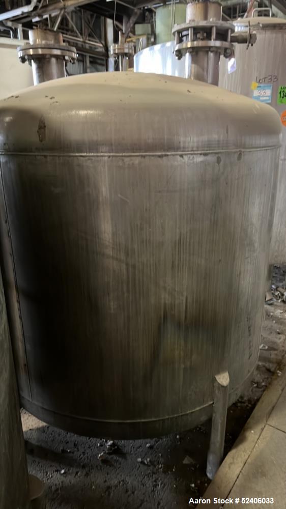 Used Tank, Approximate 950 Gallon, Stainless Steel, Vertical. Approximate 60" diameter x 72" straight side, dished top & bottom. Mounted on 4 stainless legs.