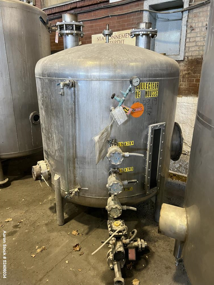 Used Tank, Approximate 550 Gallon, Stainless Steel, Vertical. Approximate 60" diameter x 42" straight side, dished top & bottom. Mounted on 4 stainless legs.