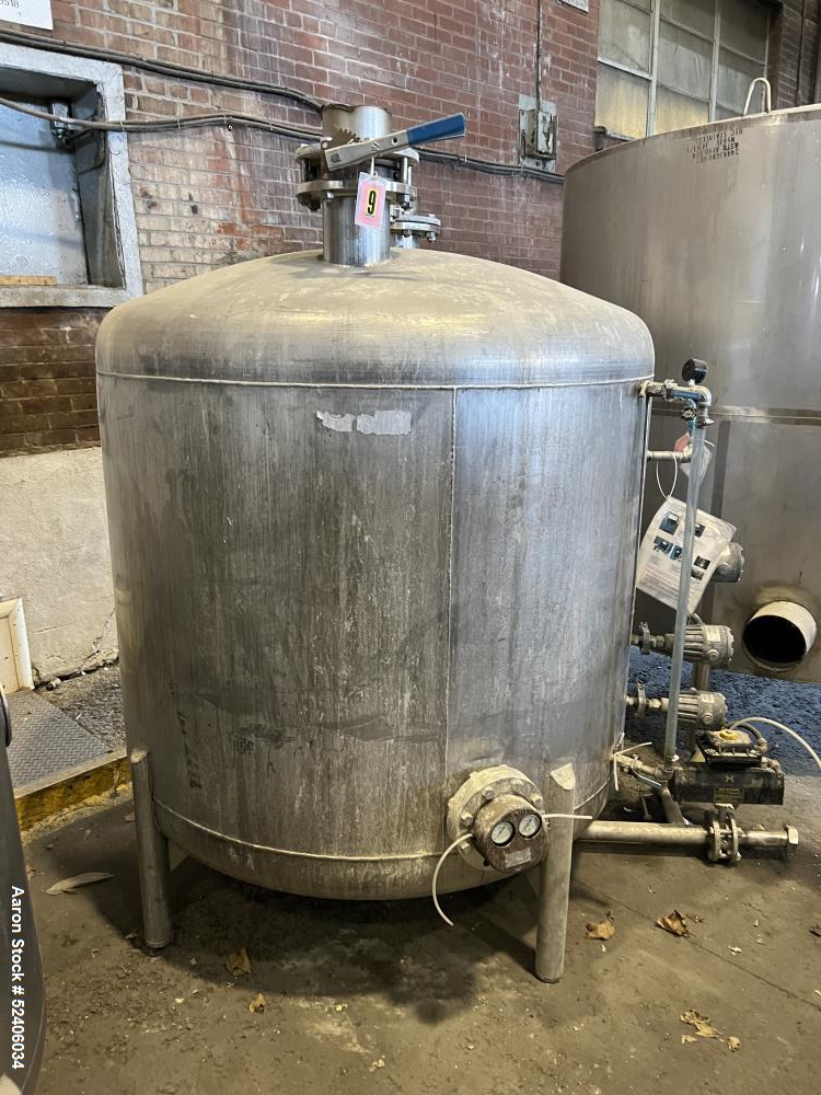 Used Tank, Approximate 550 Gallon, Stainless Steel, Vertical. Approximate 60" diameter x 42" straight side, dished top & bottom. Mounted on 4 stainless legs.