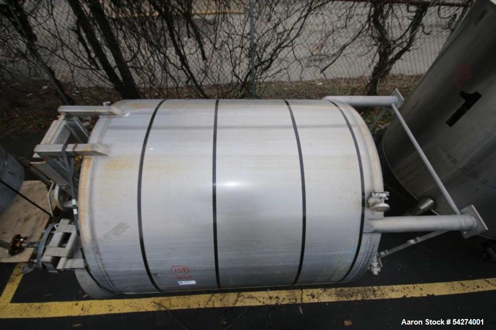 Used Aprox. 800 Gal. Dome Top, Dome Bottom S/S Tank, Single Wall, with(2) Vertical Agitator Shaft (Note: Drive Motor Not Included) & Lightnin Agitator, with Top Man Door, (4) 2" Ct Tope connection & ...