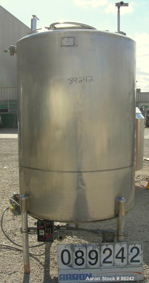 USED: Tank, 550 gallon, 316 stainless steel, vertical. 50" diameter x 64" straight side. Flat top, slight coned bottom. Openings: top (5) 1-1/2", 17" manway with cover, approximate 1-1/2" center bott...