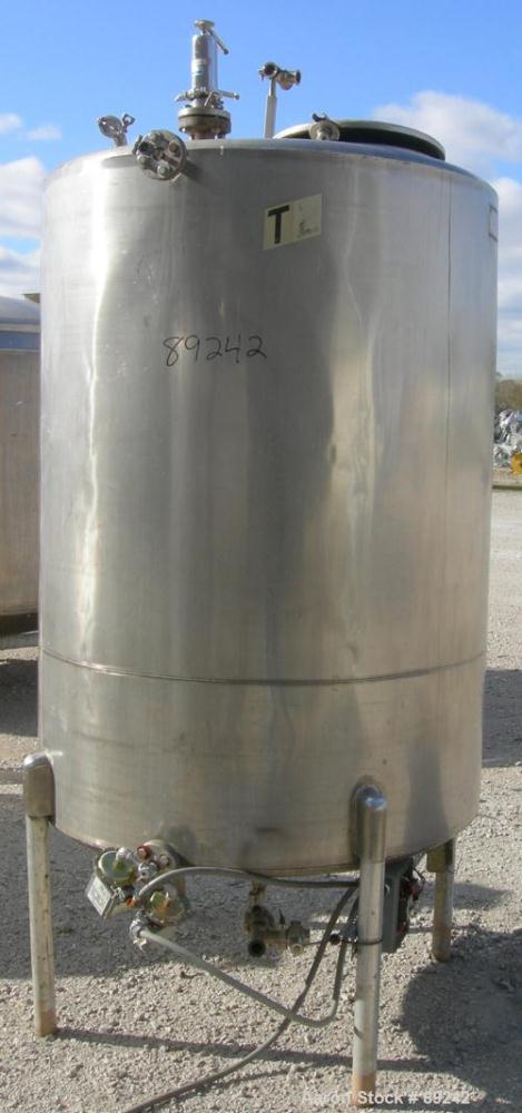 USED: Tank, 550 gallon, 316 stainless steel, vertical. 50" diameter x 64" straight side. Flat top, slight coned bottom. Openings: top (5) 1-1/2", 17" manway with cover, approximate 1-1/2" center bott...