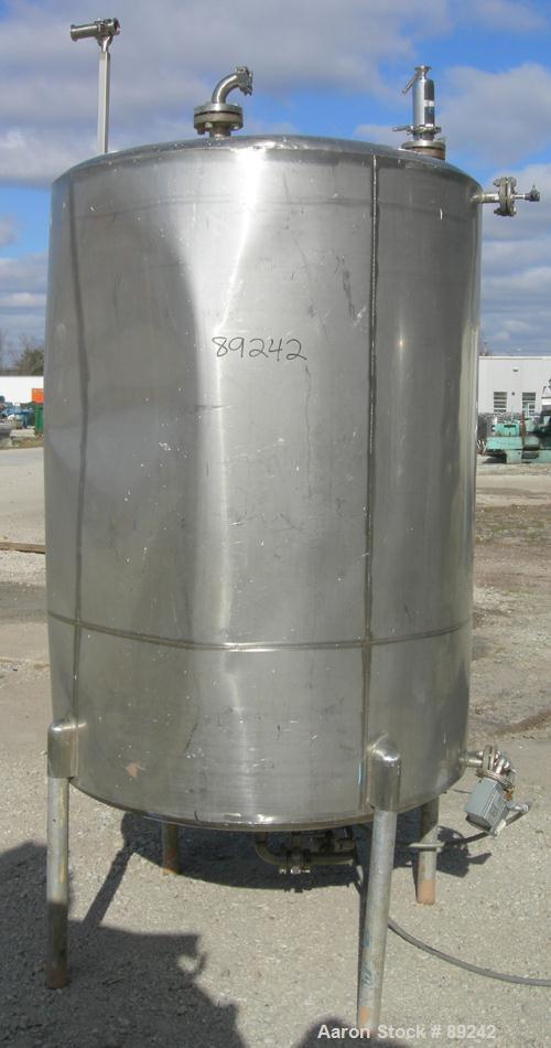 USED: Tank, 550 gallon, 316 stainless steel, vertical. 50" diameter x 64" straight side. Flat top, slight coned bottom. Openings: top (5) 1-1/2", 17" manway with cover, approximate 1-1/2" center bott...