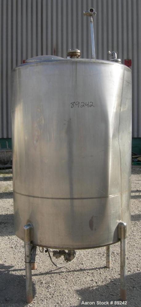 USED: Tank, 550 gallon, 316 stainless steel, vertical. 50" diameter x 64" straight side. Flat top, slight coned bottom. Openings: top (5) 1-1/2", 17" manway with cover, approximate 1-1/2" center bott...