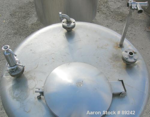 USED: Tank, 550 gallon, 316 stainless steel, vertical. 50" diameter x 64" straight side. Flat top, slight coned bottom. Openings: top (5) 1-1/2", 17" manway with cover, approximate 1-1/2" center bott...