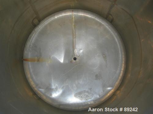 USED: Tank, 550 gallon, 316 stainless steel, vertical. 50" diameter x 64" straight side. Flat top, slight coned bottom. Openings: top (5) 1-1/2", 17" manway with cover, approximate 1-1/2" center bott...