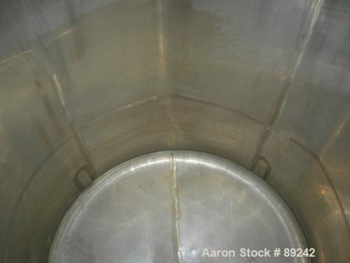 USED: Tank, 550 gallon, 316 stainless steel, vertical. 50" diameter x 64" straight side. Flat top, slight coned bottom. Openings: top (5) 1-1/2", 17" manway with cover, approximate 1-1/2" center bott...