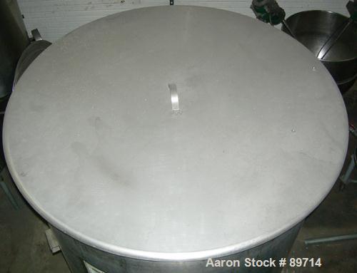 Used Chicago Carb-O-Tank, 585 Gallon, 304 Stainless Steel, Vertical. 48" diameter x 75" straight side, open top with cover, sloped bottom. Approximate 1" off center bottom outlet. Side bottom 3 blade...