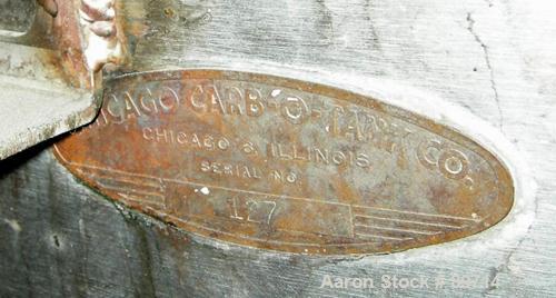 Used Chicago Carb-O-Tank, 585 Gallon, 304 Stainless Steel, Vertical. 48" diameter x 75" straight side, open top with cover, sloped bottom. Approximate 1" off center bottom outlet. Side bottom 3 blade...