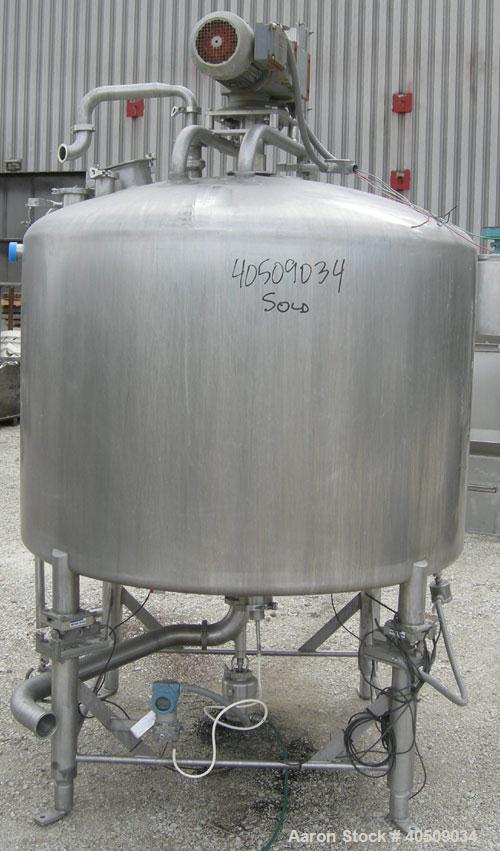 Used Creamery Package Tank, 500 Gallon, 304 stainless steel, vertical. 60" diameter x 39" straight side. Dished top, coned bottom. Fixed stainless steel agitator bridge, bottom supported anchor agita...