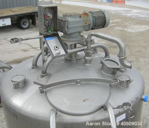 Used Creamery Package Tank, 500 Gallon, 304 stainless steel, vertical. 60" diameter x 39" straight side. Dished top, coned bottom. Fixed stainless steel agitator bridge, bottom supported anchor agita...