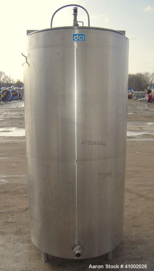 Used DCI Jacketed Tank, 750 Gallon, 304 Stainless Steel, Vertical. Flat top with 1/2 hinged cover, sloped bottom. Bottom head and 1/3 bottom sidewall dimple jacketed, rated 90 psi at 200 deg F. 2" tr...