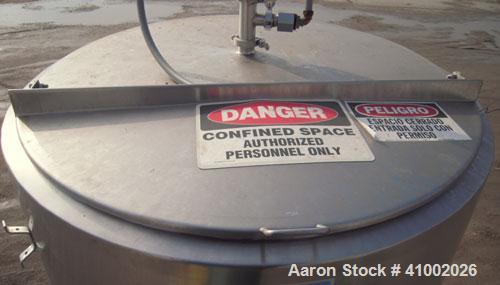 Used DCI Jacketed Tank, 750 Gallon, 304 Stainless Steel, Vertical. Flat top with 1/2 hinged cover, sloped bottom. Bottom head and 1/3 bottom sidewall dimple jacketed, rated 90 psi at 200 deg F. 2" tr...