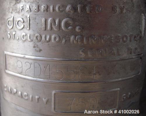 Used DCI Jacketed Tank, 750 Gallon, 304 Stainless Steel, Vertical. Flat top with 1/2 hinged cover, sloped bottom. Bottom head and 1/3 bottom sidewall dimple jacketed, rated 90 psi at 200 deg F. 2" tr...