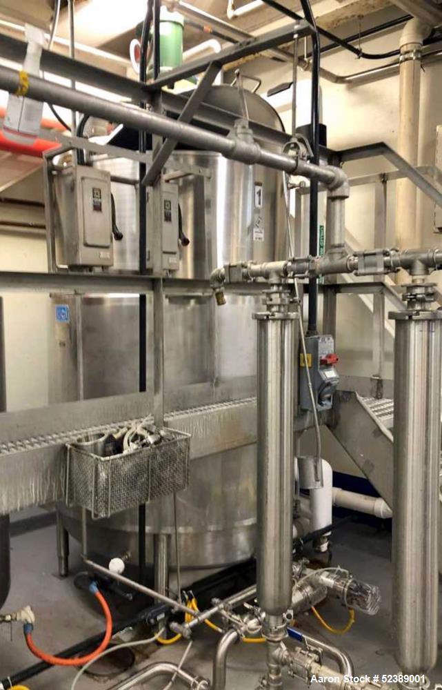 Used DCI Jacketed Mix Tank, Approximate 750 Gallon, 316 Stainless Steel, Vertical. Approximate 53.75" diameter x 81" deep. Flat top with 1/2 hinged cover, sloped bottom. 304 Stainless steel dimple ja...
