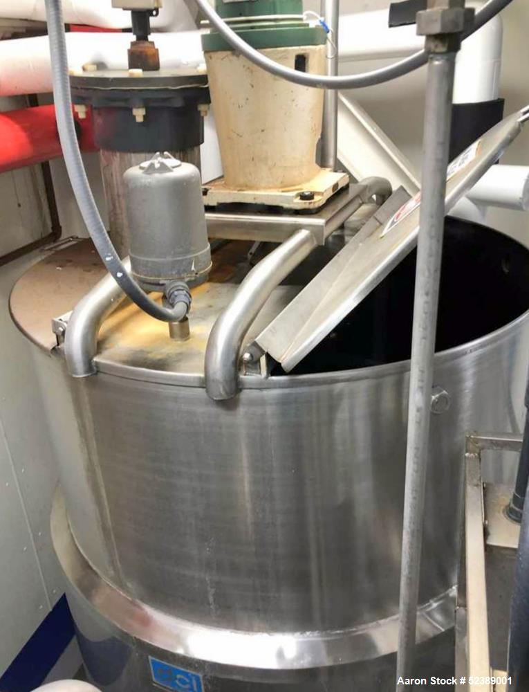 Used DCI Jacketed Mix Tank, Approximate 750 Gallon, 316 Stainless Steel, Vertical. Approximate 53.75" diameter x 81" deep. Flat top with 1/2 hinged cover, sloped bottom. 304 Stainless steel dimple ja...