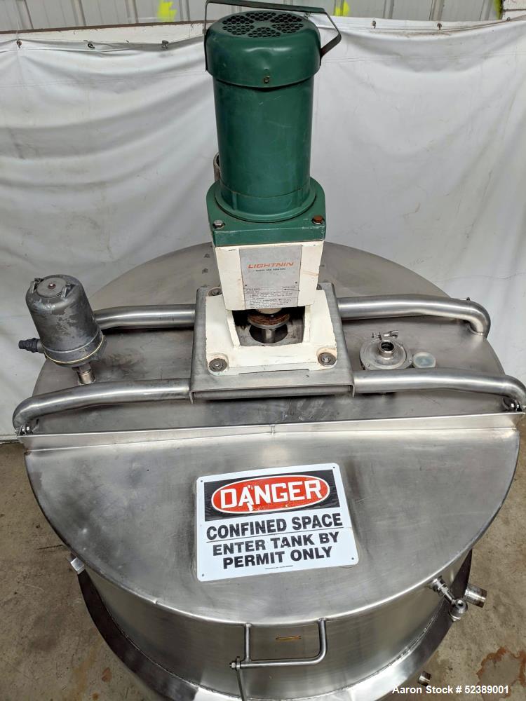 Used DCI Jacketed Mix Tank, Approximate 750 Gallon, 316 Stainless Steel, Vertical. Approximate 53.75" diameter x 81" deep. Flat top with 1/2 hinged cover, sloped bottom. 304 Stainless steel dimple ja...