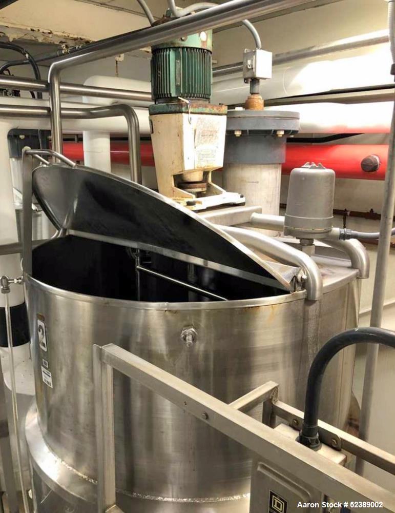 Used DCI Jacketed Mix Tank, Approximate 750 Gallon, 316 Stainless Steel, Vertical. Approximate 53.75" diameter x 81" deep. Flat top with 1/2 hinged cover, sloped bottom. 304 Stainless steel dimple ja...