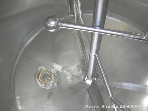 Used Dairy Craft Tank, 500 Gallon, 304 stainless steel, vertical. 60" diameter x 38" straight side. Dished top, coned bottom. Fixed stainless steel agitator bridge, bottom supported anchor style agit...