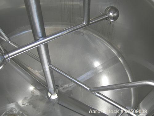 Used Dairy Craft Tank, 500 Gallon, 304 stainless steel, vertical. 60" diameter x 38" straight side. Dished top, coned bottom. Fixed stainless steel agitator bridge, bottom supported anchor style agit...