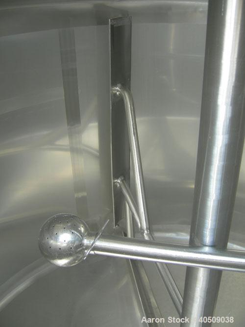 Used Dairy Craft Tank, 500 Gallon, 304 stainless steel, vertical. 60" diameter x 38" straight side. Dished top, coned bottom. Fixed stainless steel agitator bridge, bottom supported anchor style agit...