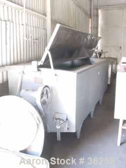 Used Delaval Coil Vat Batch Processor, 660 Gallon, 4300 Pound Capacity. 40" Wide x 106" long x approximately 36" deep. Coil agitator, 15 turns of 2" diameter pipe for heating or cooling. Insulated pa...