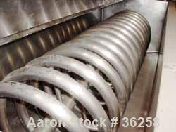 Used Delaval Coil Vat Batch Processor, 660 Gallon, 4300 Pound Capacity. 40" Wide x 106" long x approximately 36" deep. Coil agitator, 15 turns of 2" diameter pipe for heating or cooling. Insulated pa...