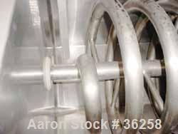 Used Delaval Coil Vat Batch Processor, 660 Gallon, 4300 Pound Capacity. 40" Wide x 106" long x approximately 36" deep. Coil agitator, 15 turns of 2" diameter pipe for heating or cooling. Insulated pa...