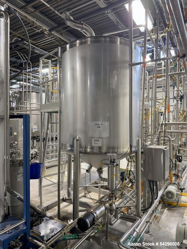 Used Feldmeier Stainless Steel Tank, Approximate 600 Gallon.  Vertical, slight dish top and cone bottom, center bottom outlet, hinged top manway cover, on (4) stainless steel legs. Serial # E-1148-12.