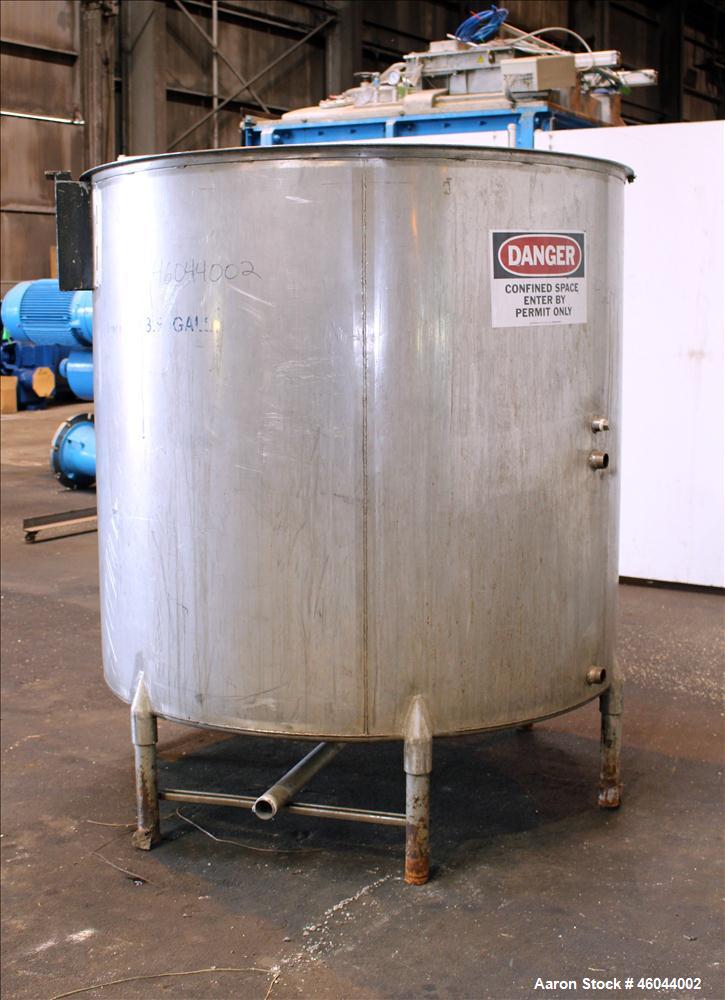 Used Filpaco Product Tank, 800 Gallon, 304 Stainless Steel, Vertical. 64" Diameter x 60" straight side. Flat top with no cover, coned bottom. 2" Internal pipe heating coil, approximately 24" tall. 2"...