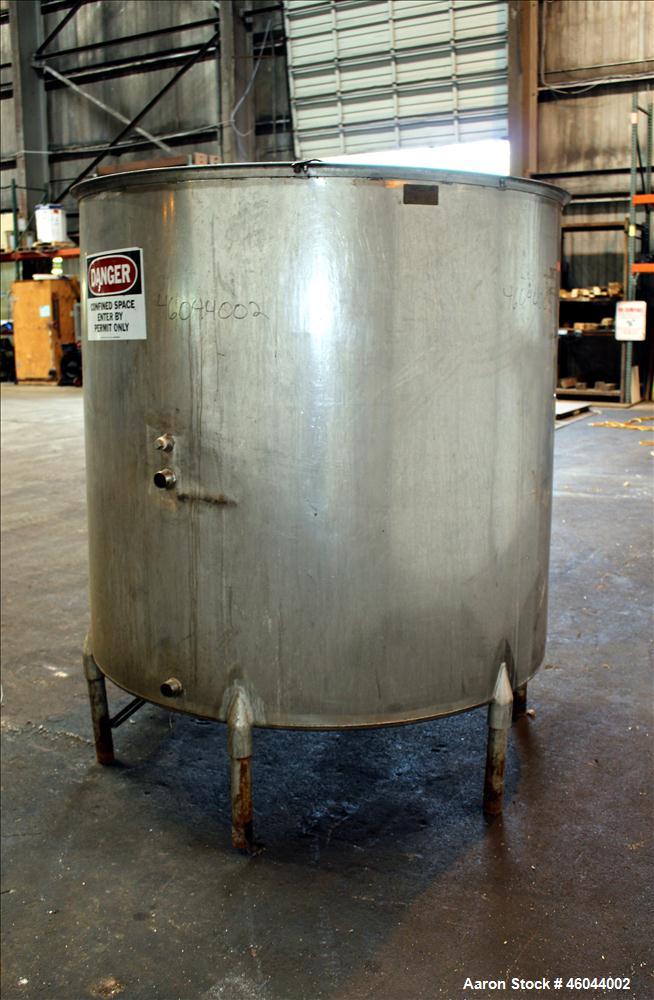 Used Filpaco Product Tank, 800 Gallon, 304 Stainless Steel, Vertical. 64" Diameter x 60" straight side. Flat top with no cover, coned bottom. 2" Internal pipe heating coil, approximately 24" tall. 2"...