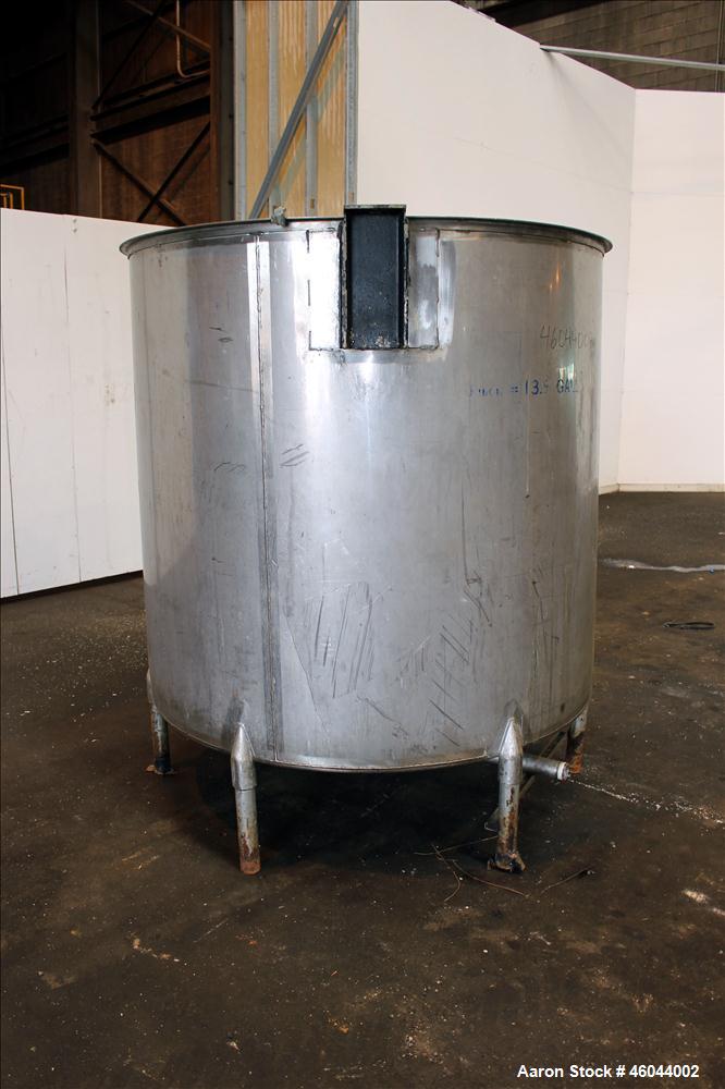Used Filpaco Product Tank, 800 Gallon, 304 Stainless Steel, Vertical. 64" Diameter x 60" straight side. Flat top with no cover, coned bottom. 2" Internal pipe heating coil, approximately 24" tall. 2"...