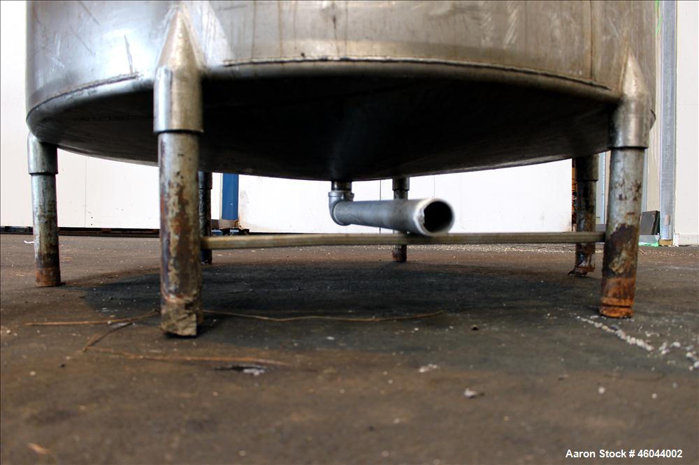 Used Filpaco Product Tank, 800 Gallon, 304 Stainless Steel, Vertical. 64" Diameter x 60" straight side. Flat top with no cover, coned bottom. 2" Internal pipe heating coil, approximately 24" tall. 2"...