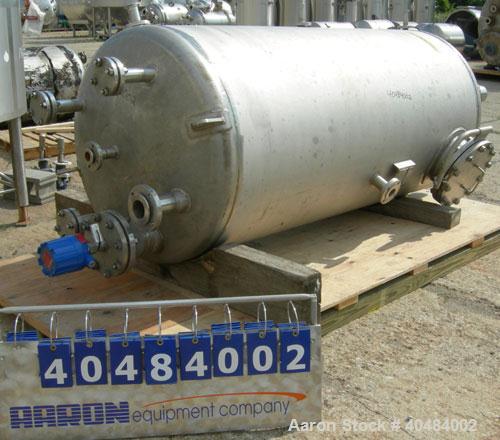 Used Four Corp pressure tank, 525 gallon, 316 stainless steel, vertical. 42" diameter x 86" straight side, dished top and bottom. Internal rated 40/-15 psi at 400 deg F. Openings: top 1 1/2", (3) 2",...
