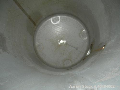Used Four Corp pressure tank, 525 gallon, 316 stainless steel, vertical. 42" diameter x 86" straight side, dished top and bottom. Internal rated 40/-15 psi at 400 deg F. Openings: top 1 1/2", (3) 2",...