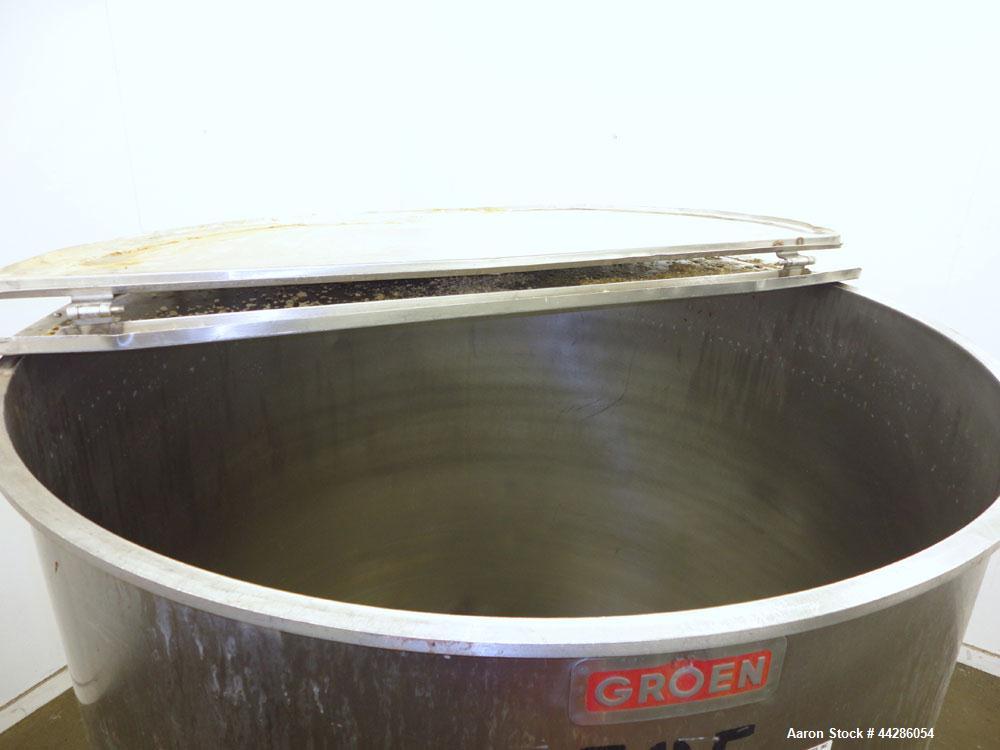 Used Groen Tank, 500 Gallon, Model SP, 304 Stainless Steel, Vertical. Approximate 54” diameter x 55” straight side. Open top with ½ hinged cover, dished bottom. 2” Center bottom outlet. Mounted on 4 ...