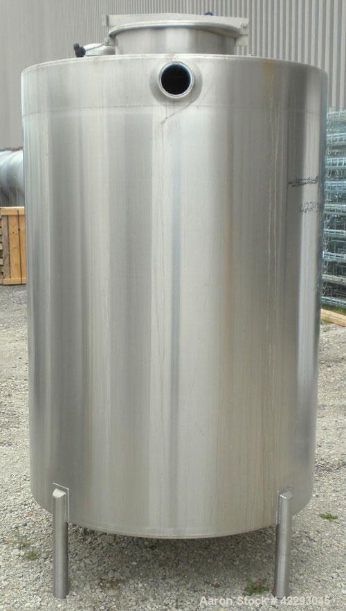 Used Hartel Tank, 500 Gallon, 304 Stainless Steel, Vertical. 48" Diameter x 66" straight side. Flat top and bottom. Openings: top (3) 1-1/2" tri-clamp, 2" tri-clamp, (3) 3" tri-clamp, 16" manway with...