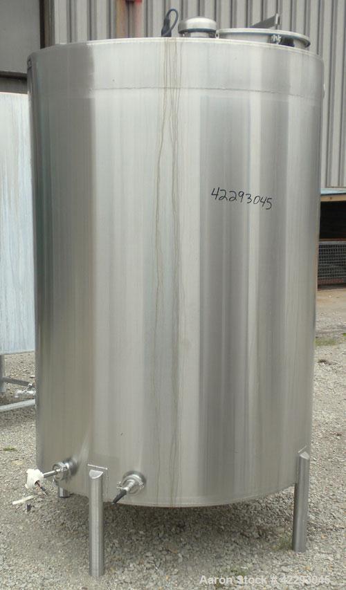 Used Hartel Tank, 500 Gallon, 304 Stainless Steel, Vertical. 48" Diameter x 66" straight side. Flat top and bottom. Openings: top (3) 1-1/2" tri-clamp, 2" tri-clamp, (3) 3" tri-clamp, 16" manway with...