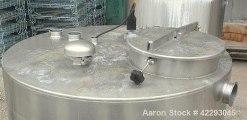 Used Hartel Tank, 500 Gallon, 304 Stainless Steel, Vertical. 48" Diameter x 66" straight side. Flat top and bottom. Openings: top (3) 1-1/2" tri-clamp, 2" tri-clamp, (3) 3" tri-clamp, 16" manway with...